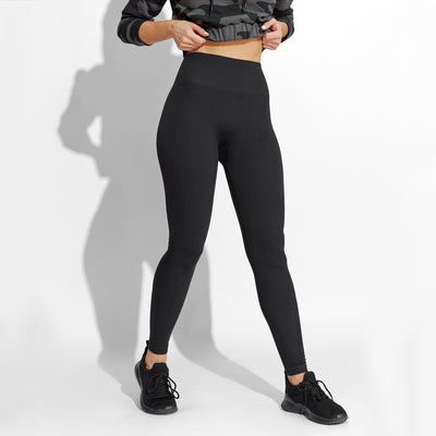 photo of female model wearing train seamless legging in black.